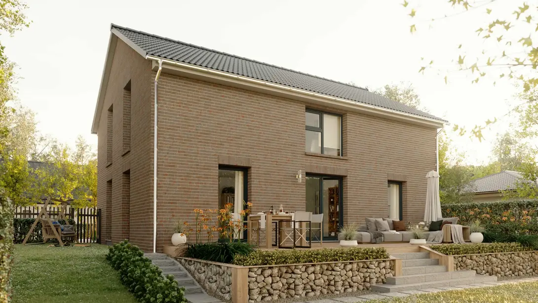 Modernes Klinkerhaus mit Terrasse und Garten Modernes Einfamilienhaus mit Klinkerfassade, Satteldach, Terrasse und Garten mit Blumen im Vordergrund