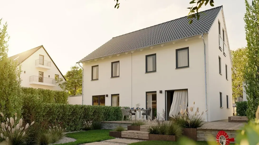 Doppelhaus bauen im Baugebiet Hopsten-Schale Modernes Doppelhaus mit heller Fassade, Satteldach, Terrasse und Garten als Beispiel für Hausbau im Baugebiet Hopsten-Schale Schützenstraße