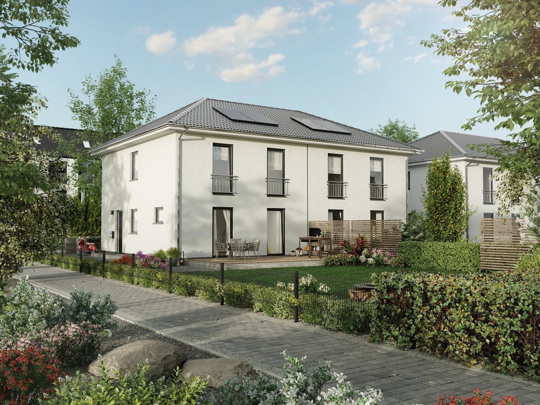 Mehrfamilienhaus im Baugebiet Vennweg Süd Modernes Mehrfamilienhaus mit heller Fassade und Grünanlage als Beispiel für Wohnen im Baugebiet Vennweg Süd in Emsdetten