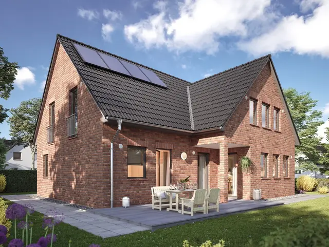 Klinker-Massivhaus in Rheine mit PV-Anlage Klinker-Einfamilienhaus in Massivbauweise mit Satteldach und Photovoltaikanlage in Rheine.