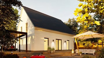 Einfamilienhaus mit Garten im Landkreis Emsland bauen mit Thielker MassivHaus Modernes Einfamilienhaus mit Satteldach, Terrasse, Garten und gemütlicher Außenbeleuchtung im Landkreis Emsland