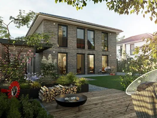 Modernes Klinkerhaus mit Garten Modernes zweigeschossiges Einfamilienhaus mit Klinkerfassade, großen Fensterflächen und Garten – Massivhaus von Thielker MassivHaus