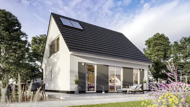 Modernes Einfamilienhaus mit Satteldach, Photovoltaik und großer Terrasse im Grünen – Massivhaus von Thielker MassivHaus