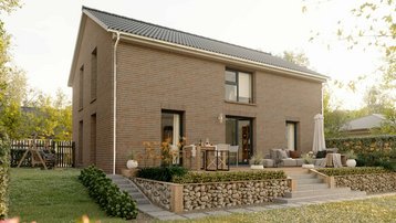 Klinkerhaus mit Terrasse und Garten Modernes Einfamilienhaus mit Klinkerfassade, Satteldach, Terrasse und blühendem Garten