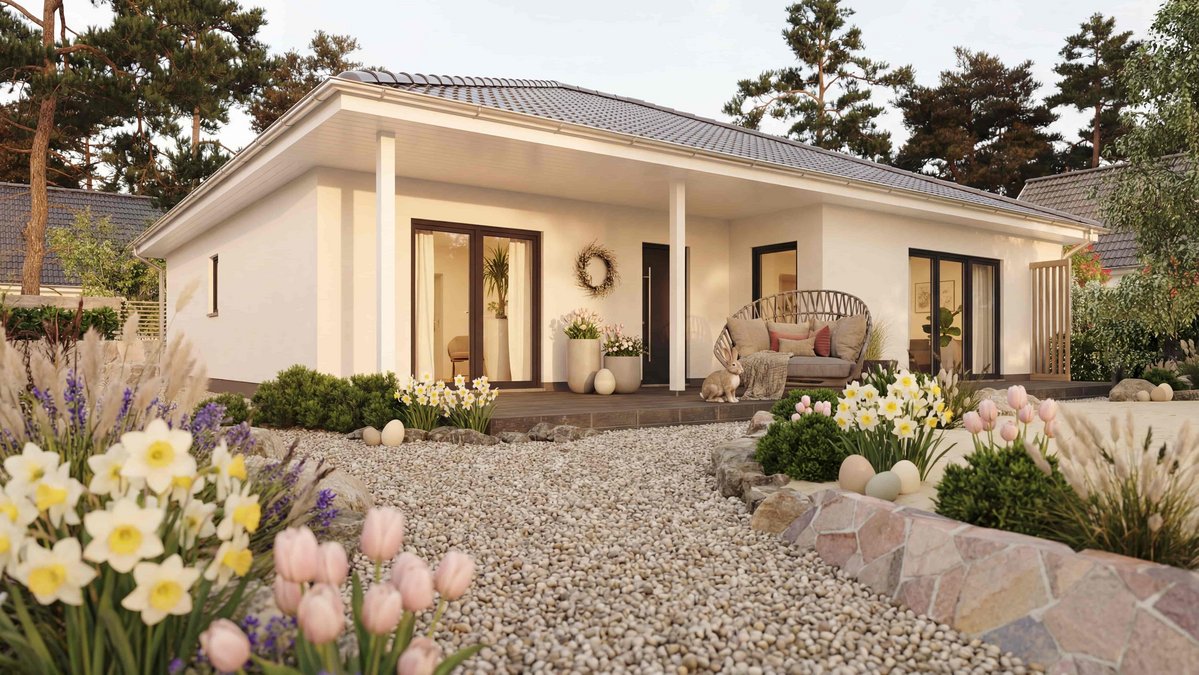 Moderner Bungalow mit überdachter Terrasse, heller Fassade und liebevoll angelegtem Garten im Landkreis Emsland
