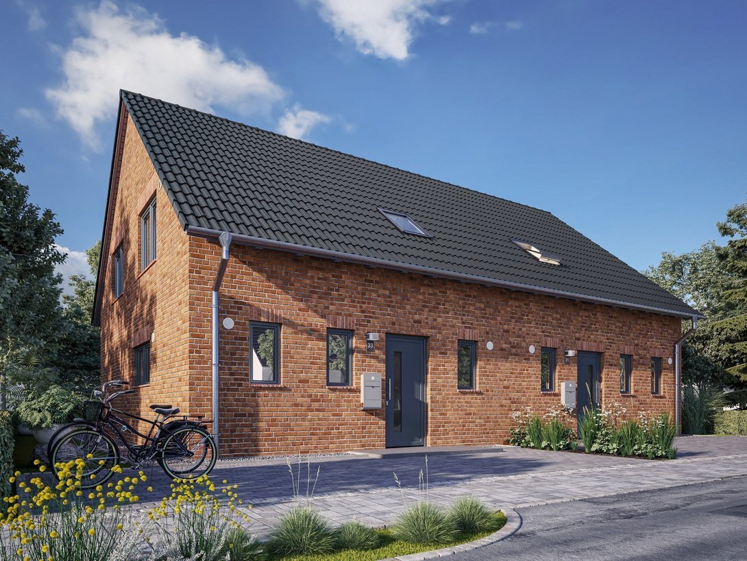 Modernes Klinkerhaus mit Satteldach und Fahrrad vor dem Haus – Massivhaus im Münsterland.
