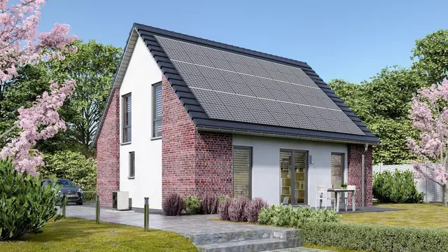 Modernes Einfamilienhaus mit Photovoltaik und Satteldach Modernes Einfamilienhaus mit Satteldach, Solaranlage und Klinkerfassade im Garten