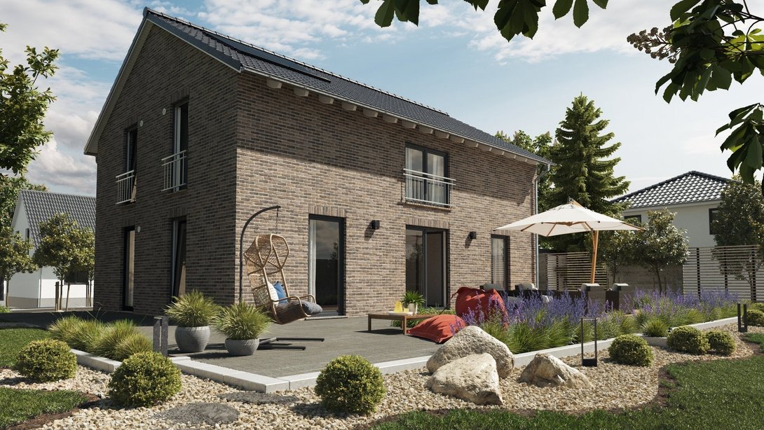 Modernes Einfamilienhaus mit Klinkerfassade, großer Terrasse und Garten – Massivhaus von Thielker MassivHaus