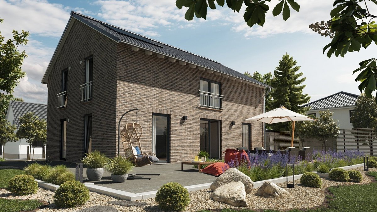 Modernes Klinkerhaus mit großer Terrasse und Gartenanlage – Massivhaus in Westerkappeln.