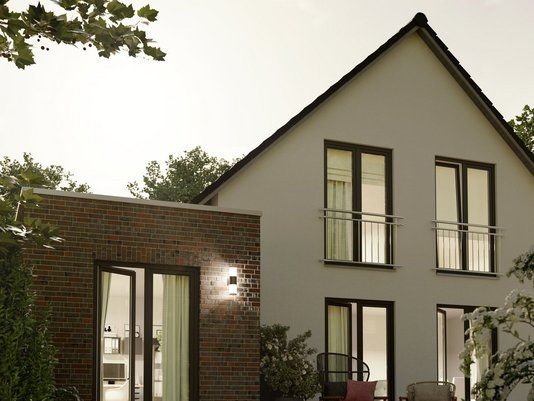 Modernes Einfamilienhaus mit Satteldach, Klinkeranbau und Terrasse – Massivhaus in ruhiger Wohnlage im Münsterland.