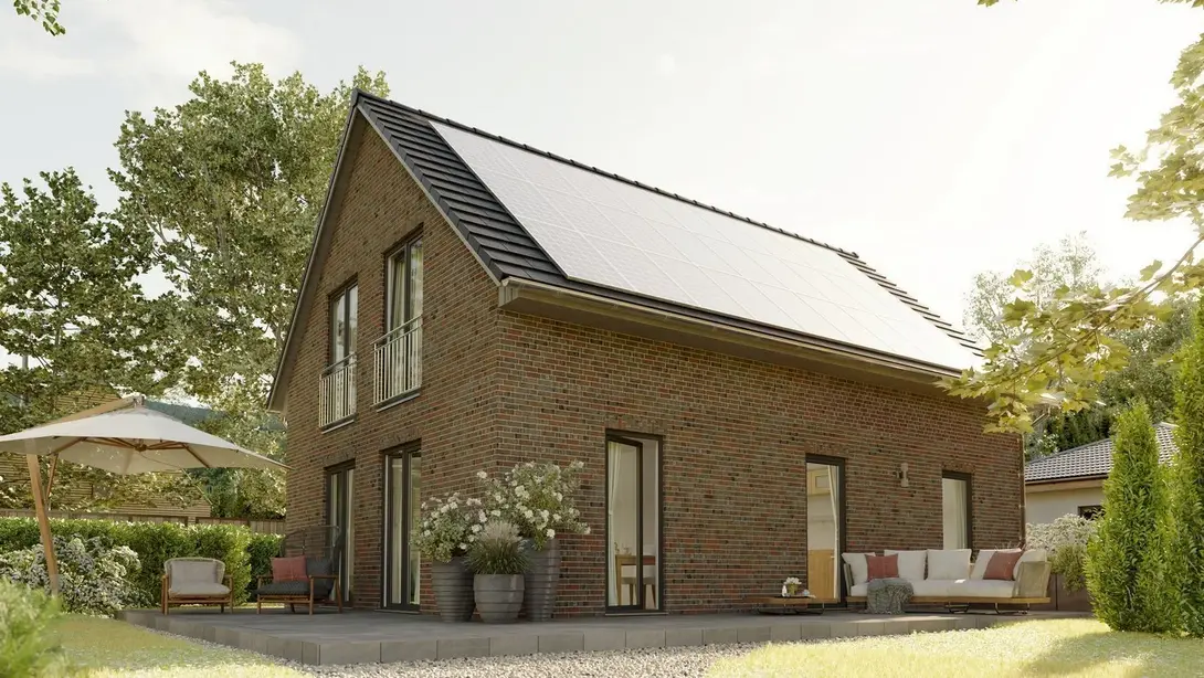 Einfamilienhaus bauen im Landkreis Emsland mit Thielker MassivHaus Modernes Einfamilienhaus mit Klinkerfassade, Photovoltaikanlage, Terrasse und Garten im Landkreis Emsland