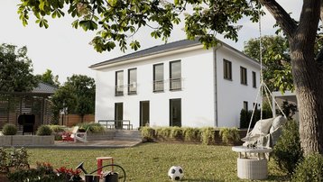 Stadtvilla mit Garten im Landkreis Emsland bauen mit Thielker MassivHaus Moderne Stadtvilla mit heller Fassade, großem Garten, Terrasse und Spielbereich im Landkreis Emsland