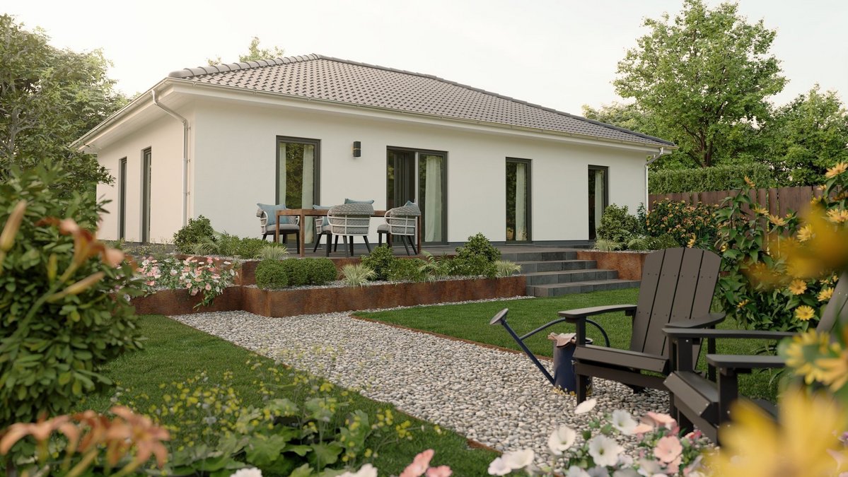 Moderner Bungalow mit heller Fassade, Terrasse, Gartenweg und gepflegter Außenanlage im Landkreis Emsland