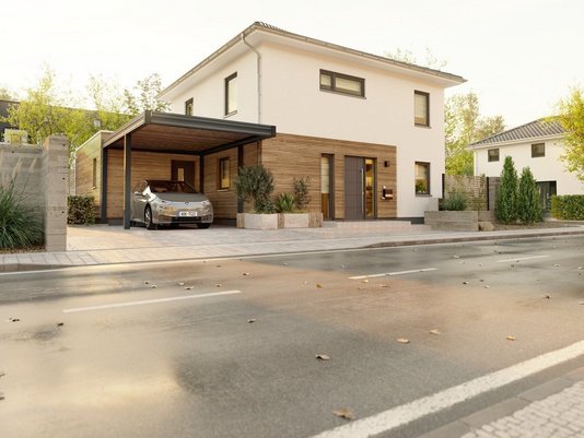 Modernes Massivhaus mit Holzfassade und Carport an einer ruhigen Straße – Einfamilienhaus von Thielker Massivhaus.